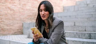 Woman looking down at her phone